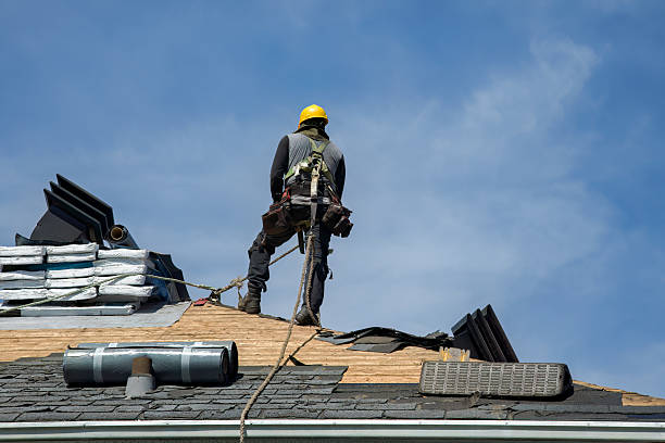 Professional Roofing technician working in Lake City, PA